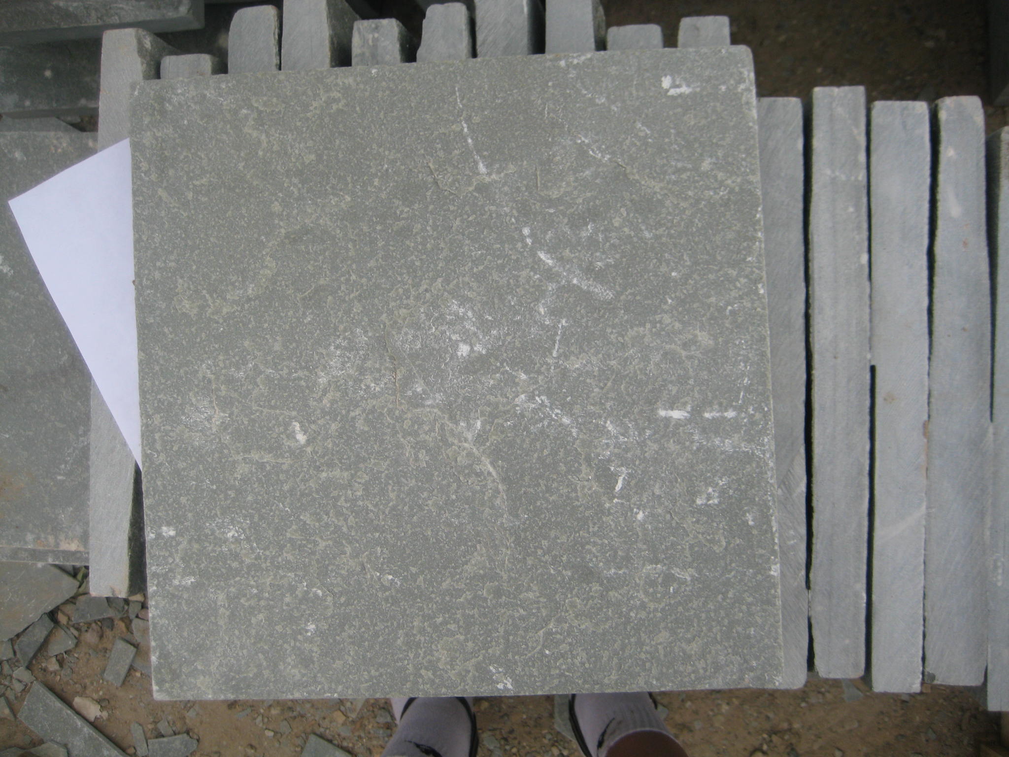 Slate is a fine-grained, foliated, homogeneous metamorphic rock derived from an original shale-type...